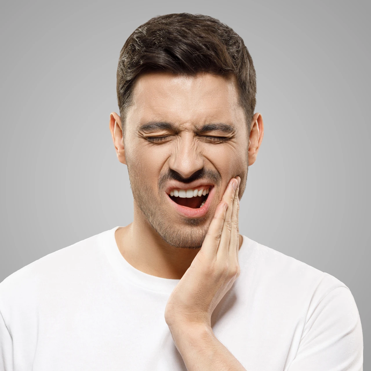 man experiencing jaw pain who needs tmj treatment