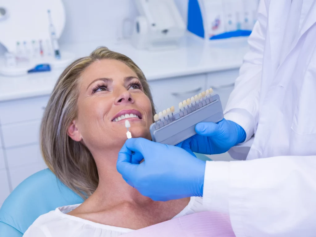 woman at dentist office getting her teeth professionally whitened